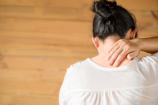 woman-feeling-exhausted-suffering-from-neck-pain-min-1-600x400